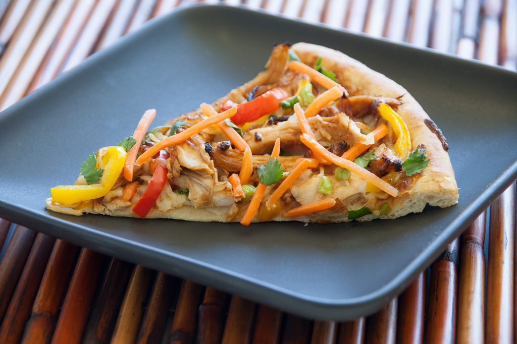 This wonderful pizza is topped with lots of crunchy vegetables and has great Asian flavors.