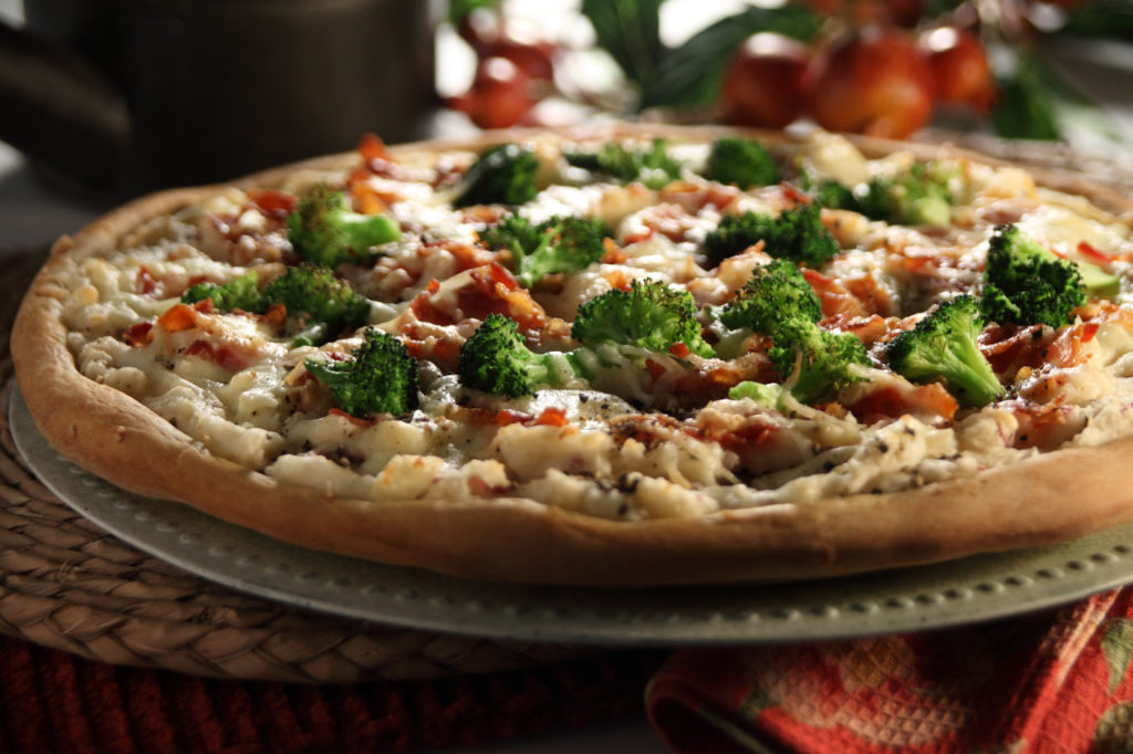 Savory garlic mashed potatoes on a pizza crust. What a great idea!