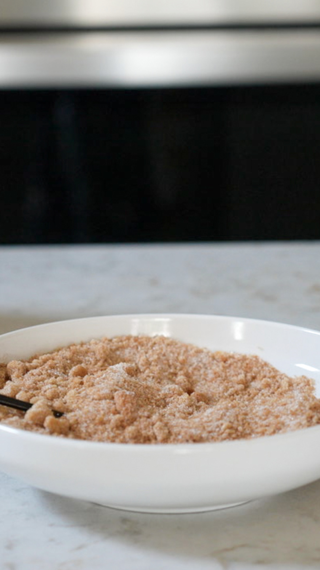 Sugar and pumpkin spice seasoning mixed in bowl.