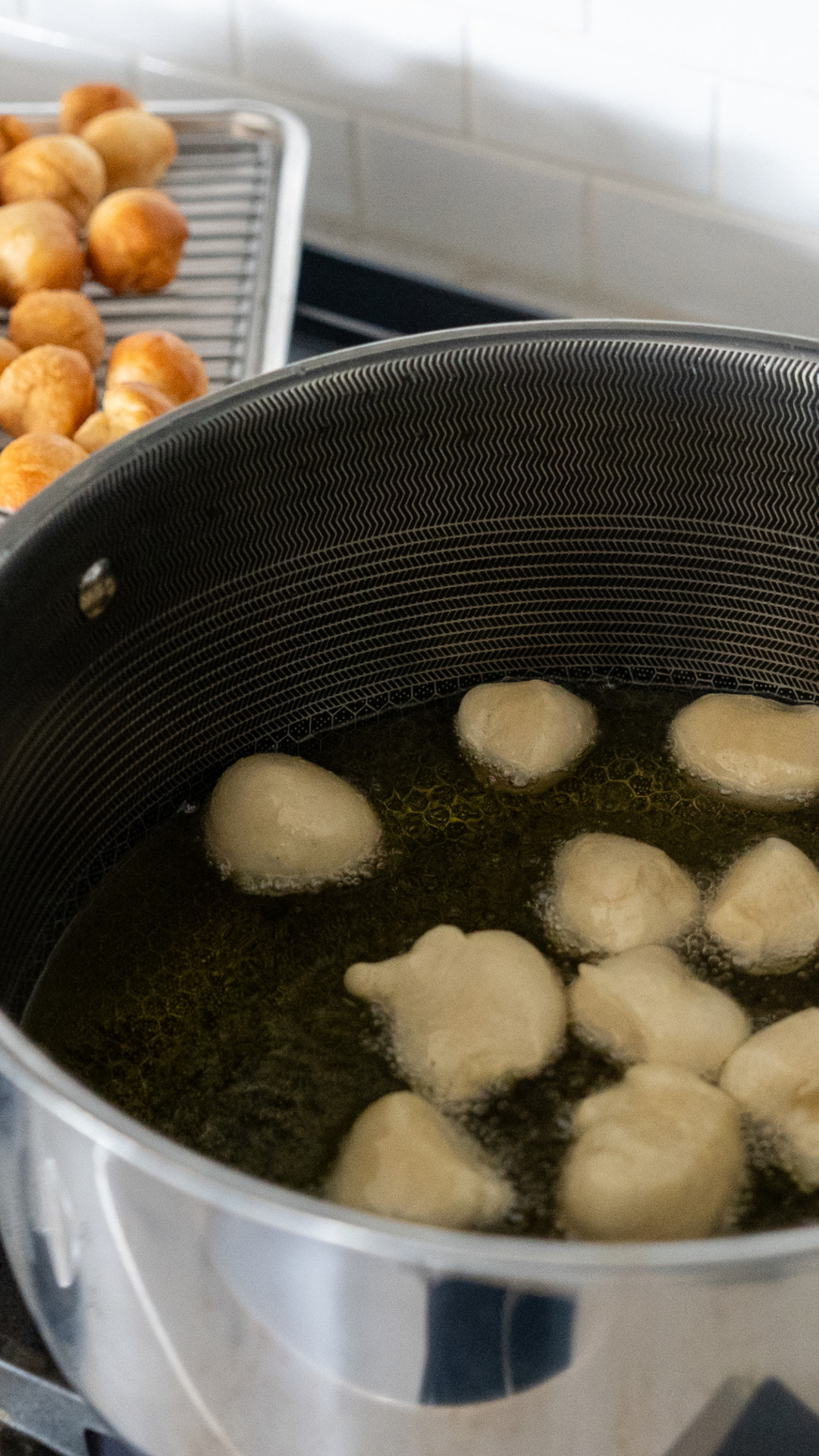 Dough frying in oil.