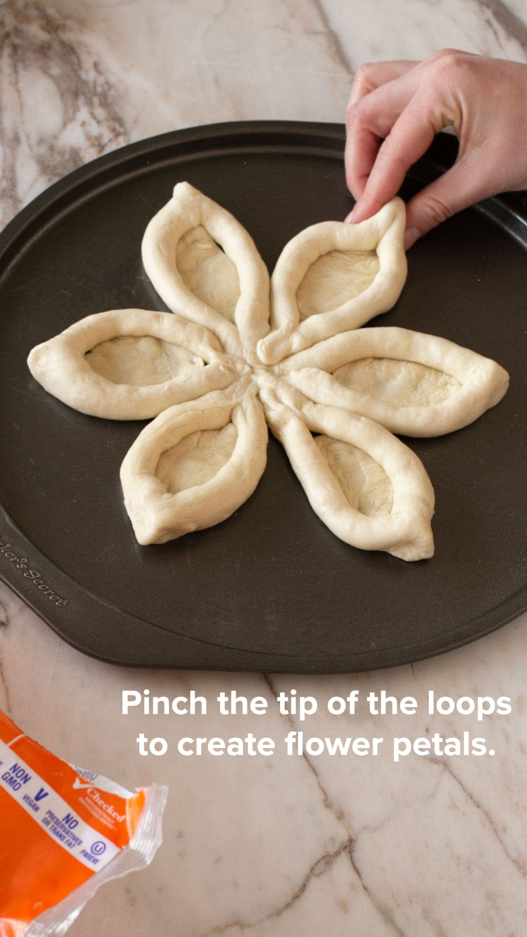 Pinch to the tops of each loop to create a flower petal shape.