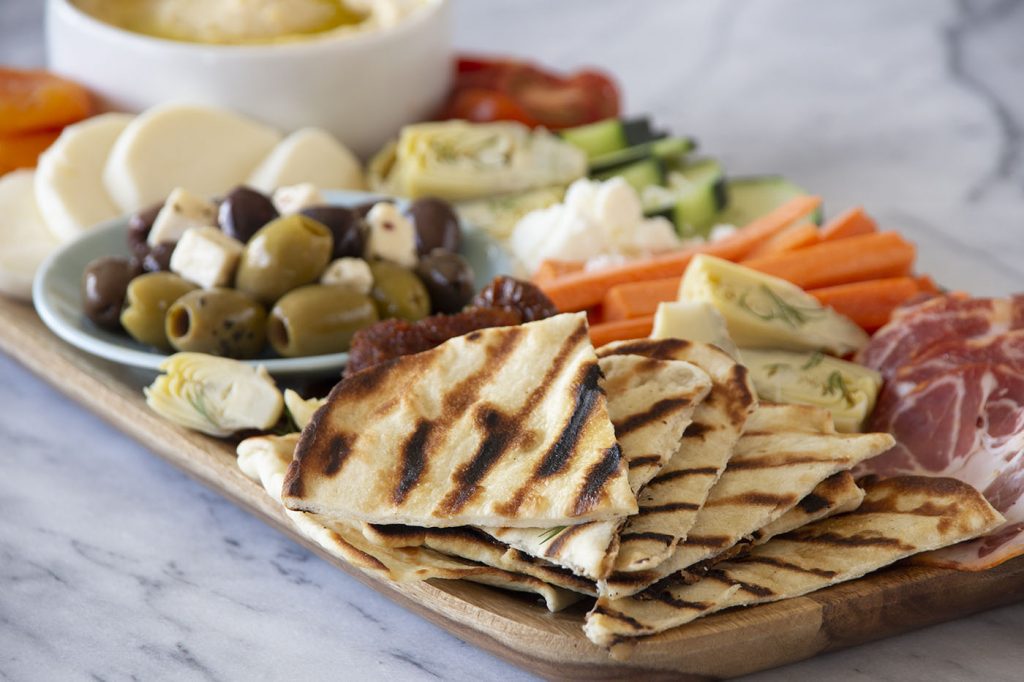 Grilled flatbread is the perfect addition to your favorite hummus board.