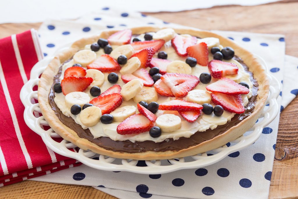 This fresh dessert pizza is perfect for any celebration of the red, white and blue.