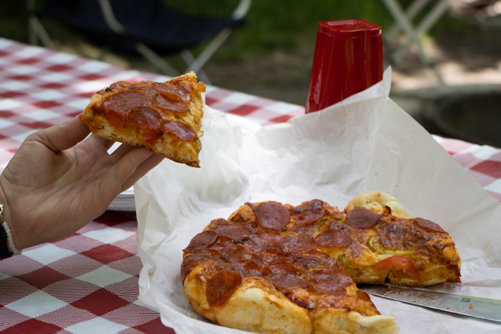 A delicious deep dish pizza baked to perfection in a Dutch Oven. Heart enough to satisfy the appetite being outdoors brings.