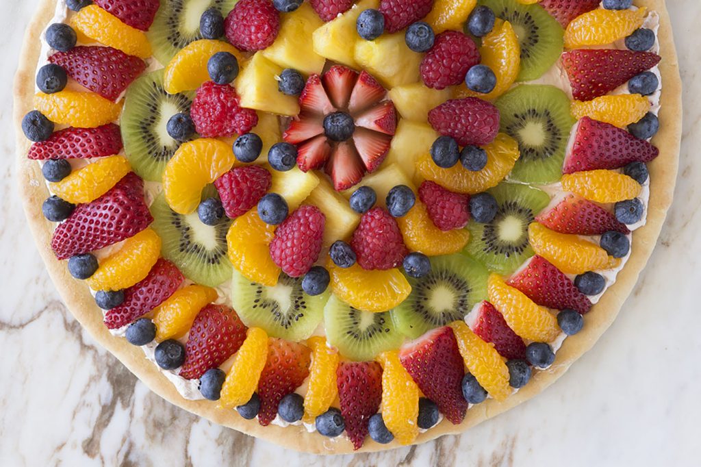 Savor the flavors of fresh summer fruits with this dreamy whipped cream fruit pizza.