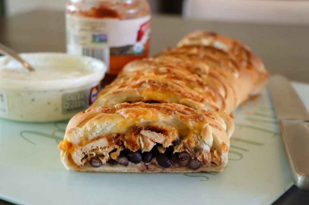 Photo of Chicken Taco Braid recipe served with salsa and sour cream.