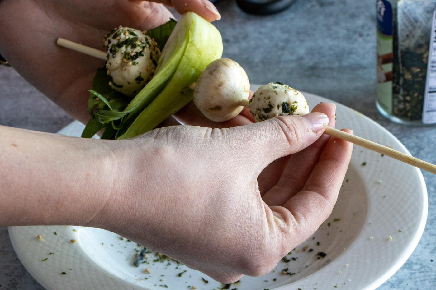 Assembling asian chicken skewers.