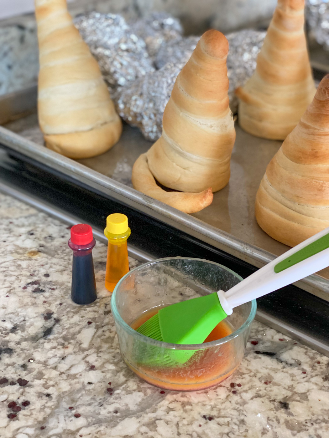 Paint baked cones with red and yellow food coloring.