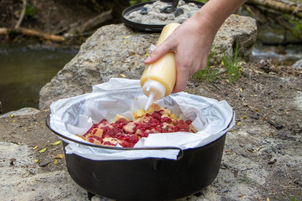 Take a classic Raspberry Bread Pudding outdoors with this Dutch Oven recipe. Here's a secret: the Vanilla Cream Sauce is divine!
